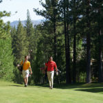 golf players walking